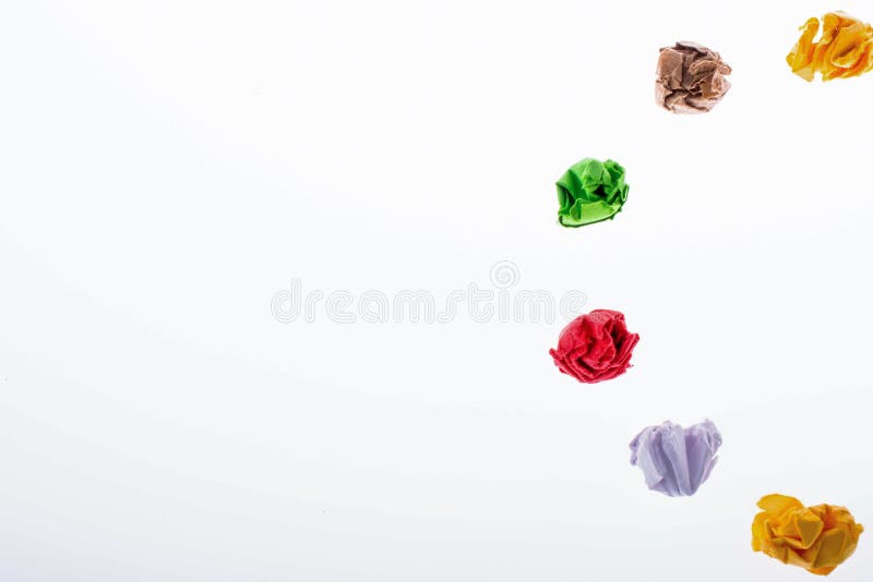 Colorful crumpled papers form a half round shape stock images.