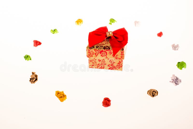 Colorful crumpled papers and a gift box stock photos