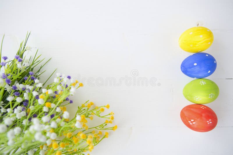 Colorful decorated easter eggs on white wood background. royalty free stock images