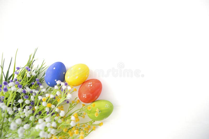 Colorful decorated easter eggs on white wood background. stock photography