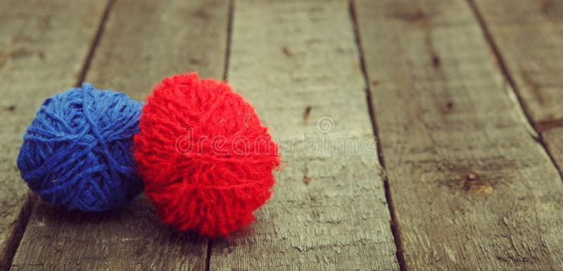 Colorful decorated easter eggs from wool yarn on wood. royalty free stock photo