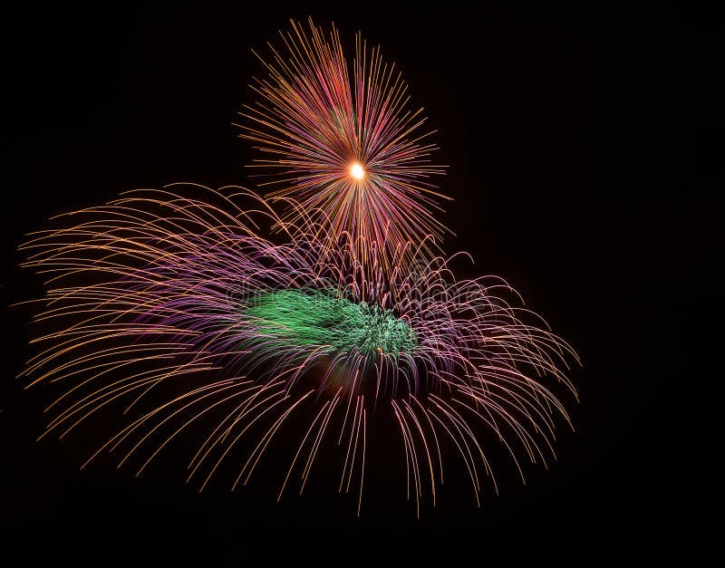 Colorful different colors, amazing fireworks in Malta, dark sky background and house light in the far, Independence day, fireworks stock photography Colorful different colors, amazing fireworks in Malta, dark sky background and house light in the far, Independence day, fireworks stock photography