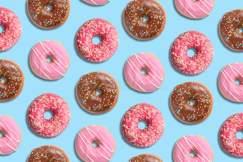 Colorful Donut Pattern on Pastel Blue Background. Creative Minimal Summer Concept Stock Image