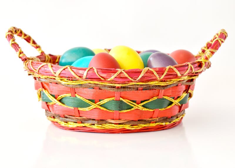Colorful Easter eggs in basket stock photos Colorful Easter eggs in basket stock photos