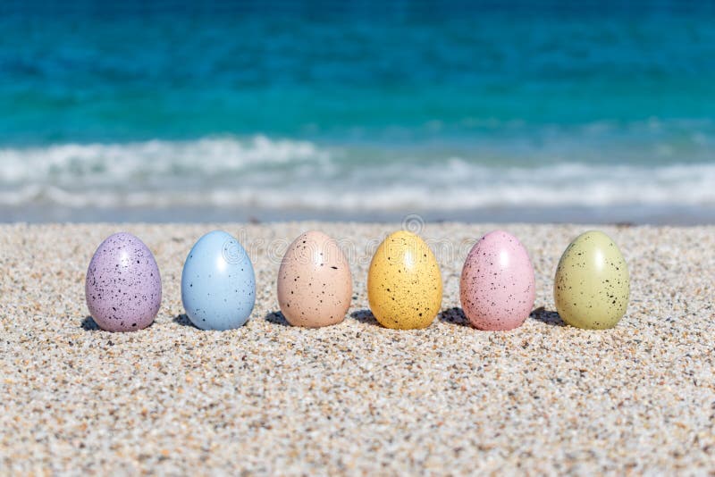Colorful Easter Eggs on the Beach in Sunny Day. Stock Image Image of