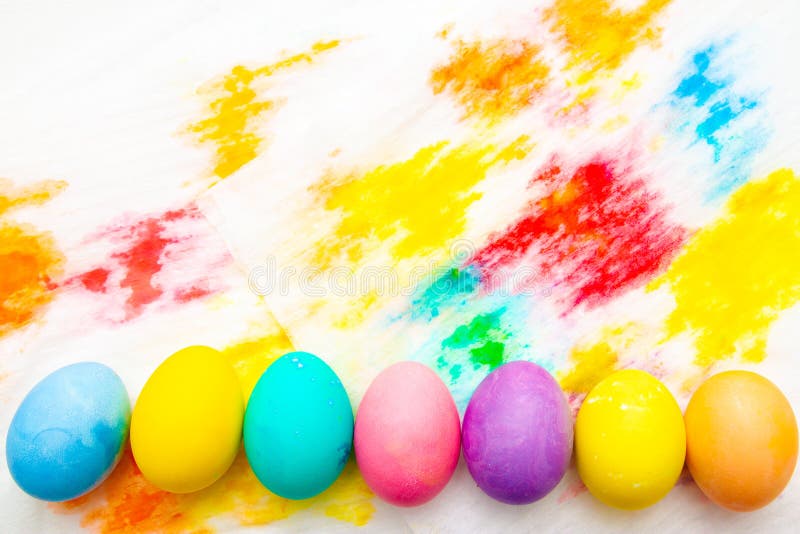 Colorful Easter eggs frame border on multicolor painted background. top view, copyspace royalty free stock photos Colorful Easter eggs frame border on multicolor painted background. top view, copyspace royalty free stock photos
