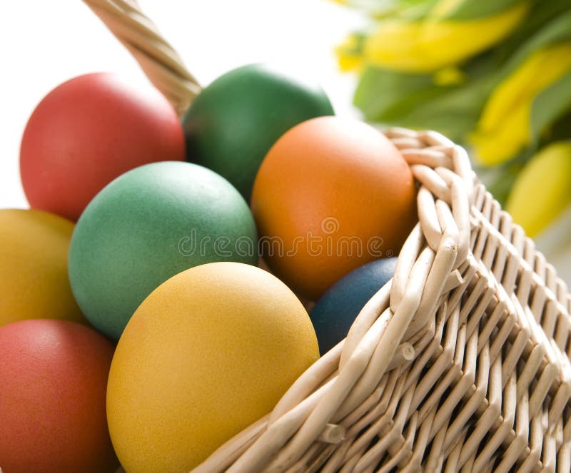 Colorful easter eggs in wooden bowl