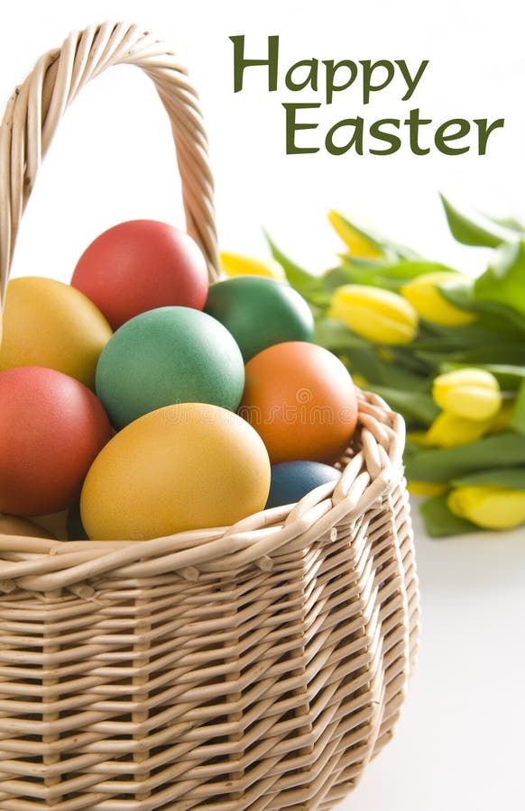 Colorful easter eggs and yellow tulips