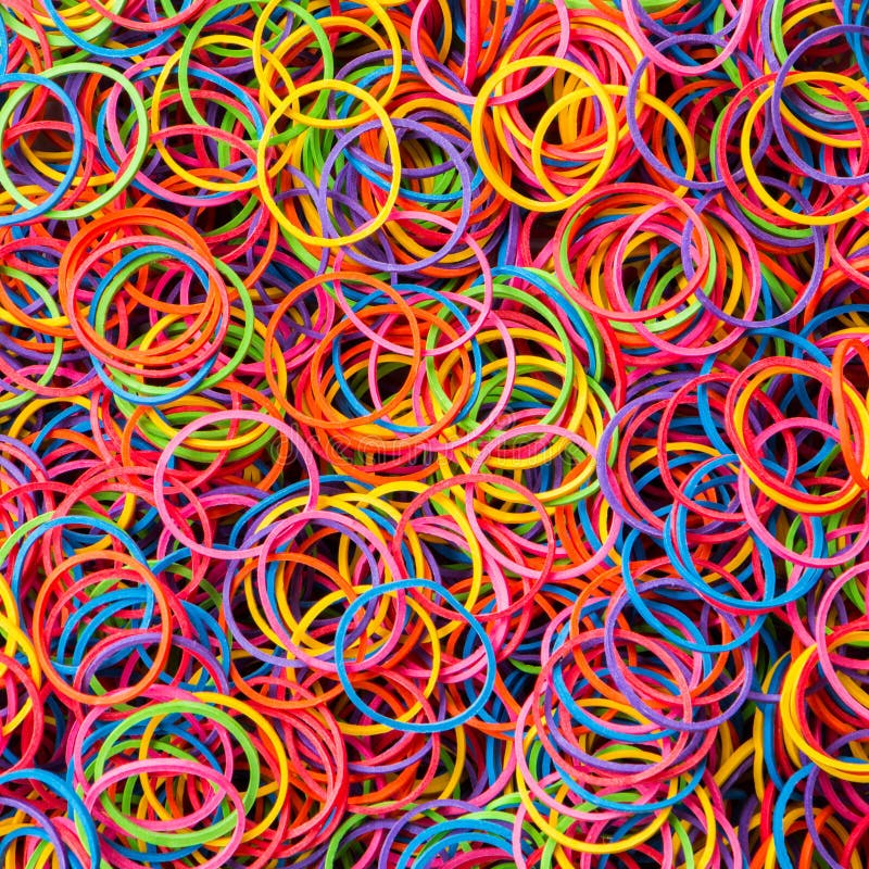 Colorful Elastic Rubber Bands on White Texture Background Stock Photo