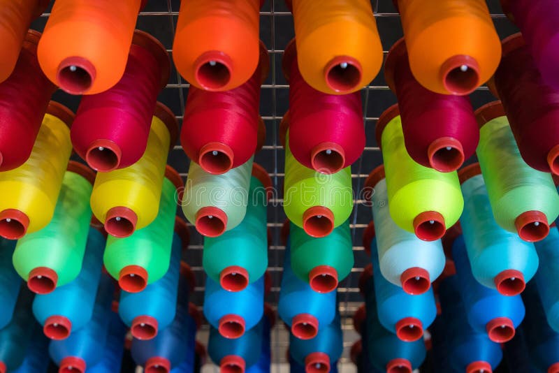 Colorful embroidery thread spool using in garment industry, row royalty free stock photo