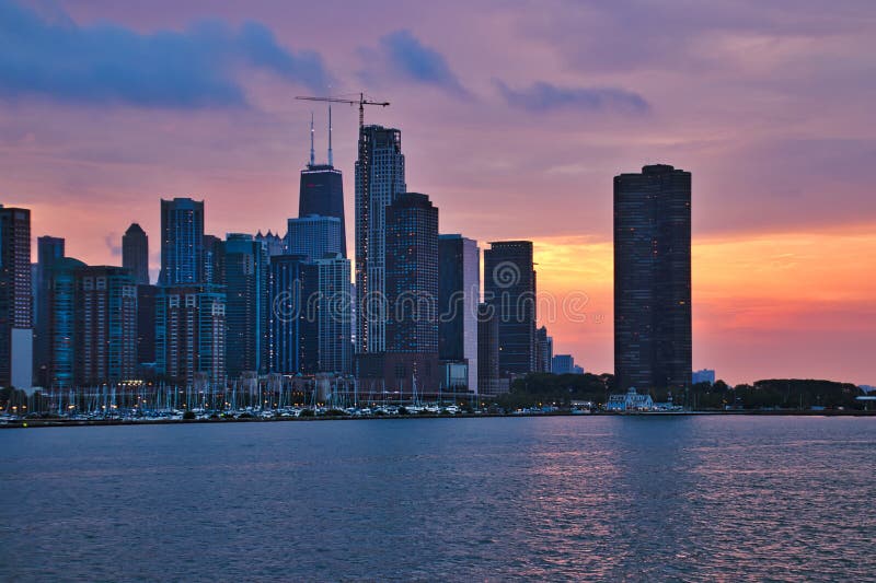 Colorful evening sunset over Chicago skyline with buildings of old, new and current construction royalty free stock photography Colorful evening sunset over Chicago skyline with buildings of old, new and current construction royalty free stock photography