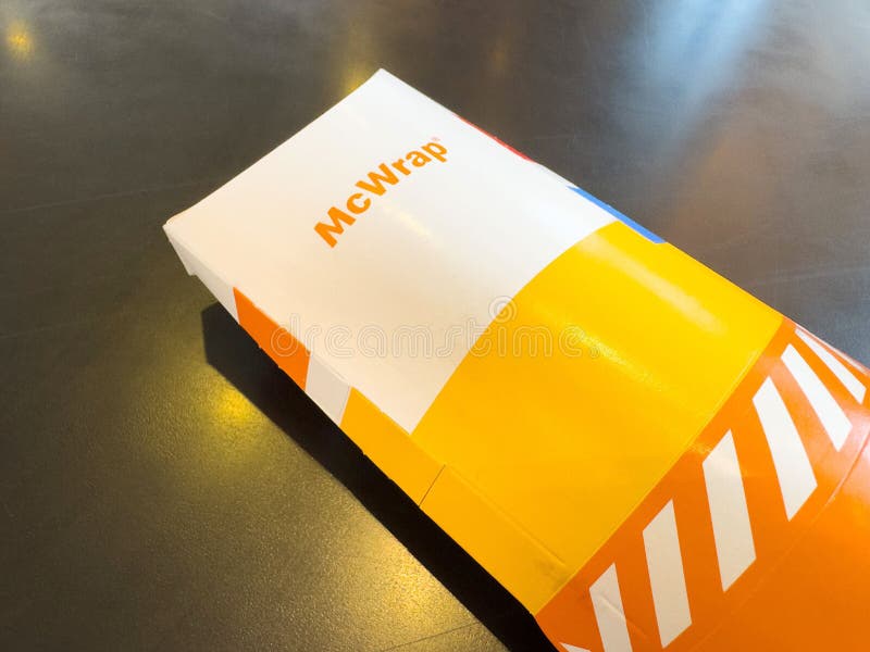 Colorful fast food packaging on dark surface royalty free illustration