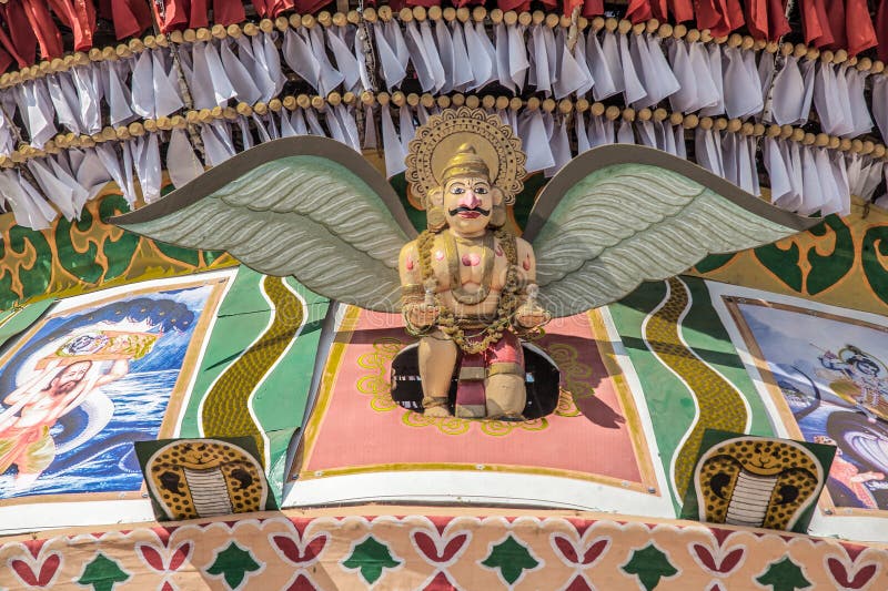 Colorful figures of Garuda and serpent Shesha on richly decorated facade stock photo
