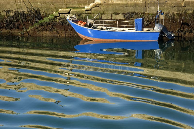 Colorful fishing boat and wavy water, Northern Portugal