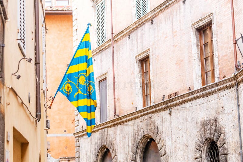 Colorful Flag of the Siena districts for the Palio festival in Tuscany. 17 OCTOBER 2018, SIENA, ITALY: Colorful Flag of the Siena districts for the Palio stock photos Colorful Flag of the Siena districts for the Palio festival in Tuscany. 17 OCTOBER 2018, SIENA, ITALY: Colorful Flag of the Siena districts for the Palio stock photos