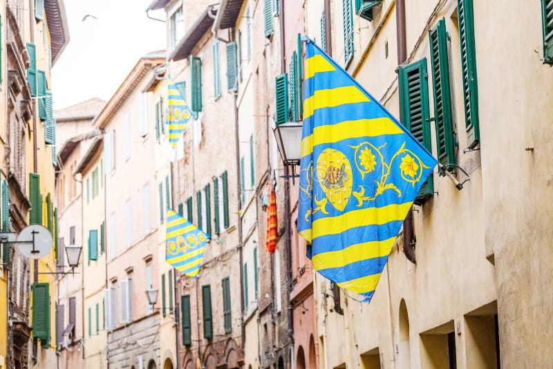 Colorful Flag of the Siena districts for the Palio festival in Tuscany. 17 OCTOBER 2018, SIENA, ITALY: Colorful Flag of the Siena districts for the Palio stock photography Colorful Flag of the Siena districts for the Palio festival in Tuscany. 17 OCTOBER 2018, SIENA, ITALY: Colorful Flag of the Siena districts for the Palio stock photography