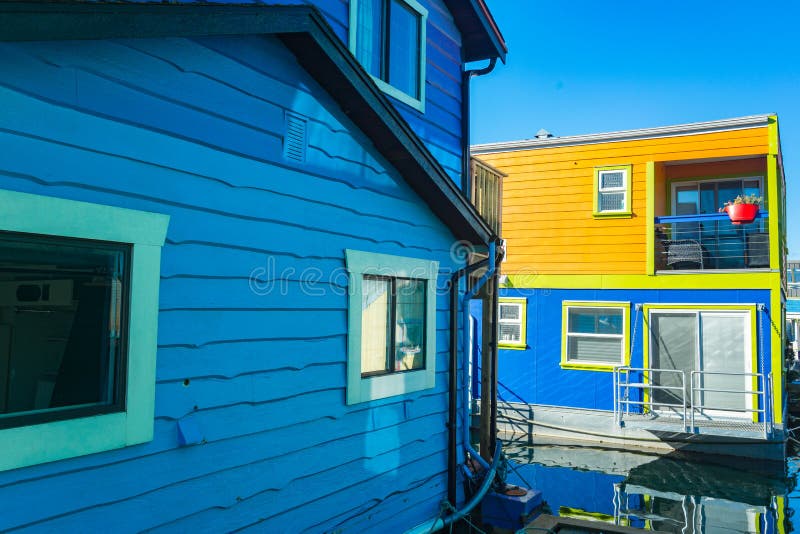 Colorful floating homes in the harbour.Economical living in overcrowded city