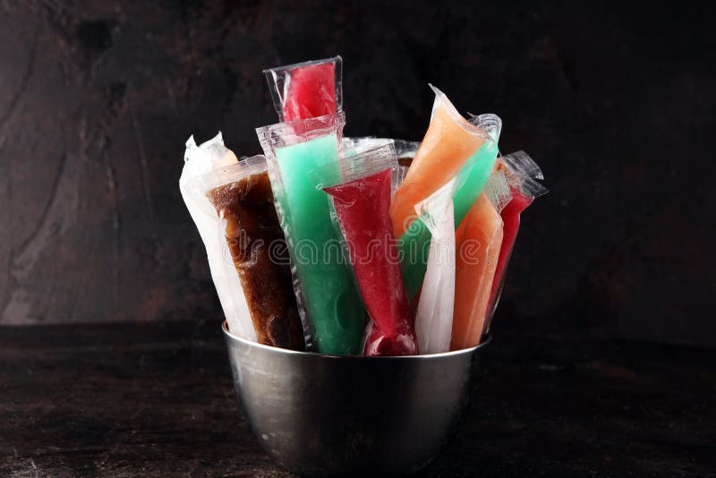 Colorful frozen fruit bar ice pops. Frozen Popsicles royalty free stock photos