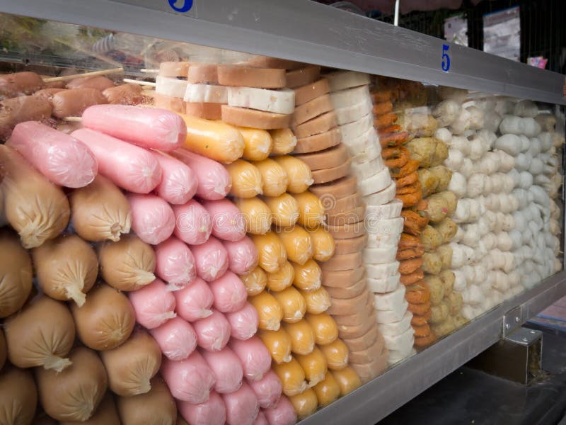 Colorful frozen sausages stock photo