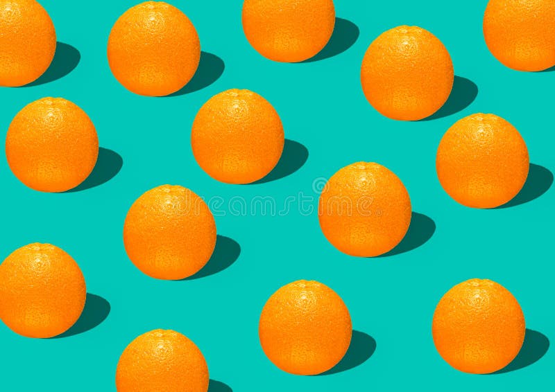 Colorful fruit pattern of fresh orange slices on green background top view orange fruit pattern background Flat lay orange backgro