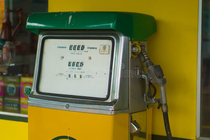 Colorful fuel pump filling nozzle, gas station