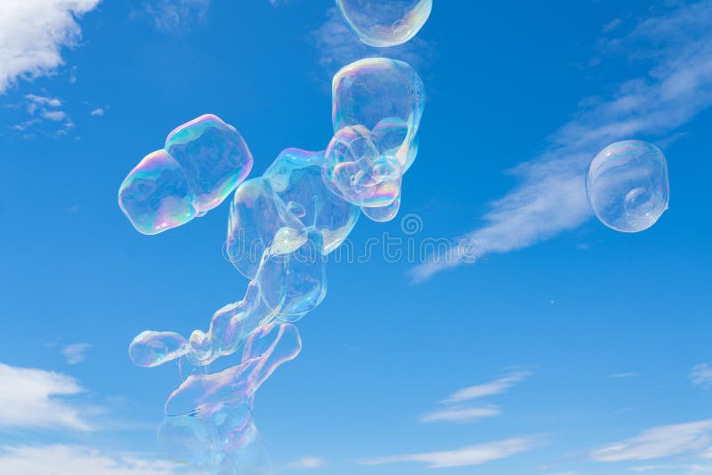 Colorful giant soap bubbles floating in the sky stock photos Colorful giant soap bubbles floating in the sky stock photos