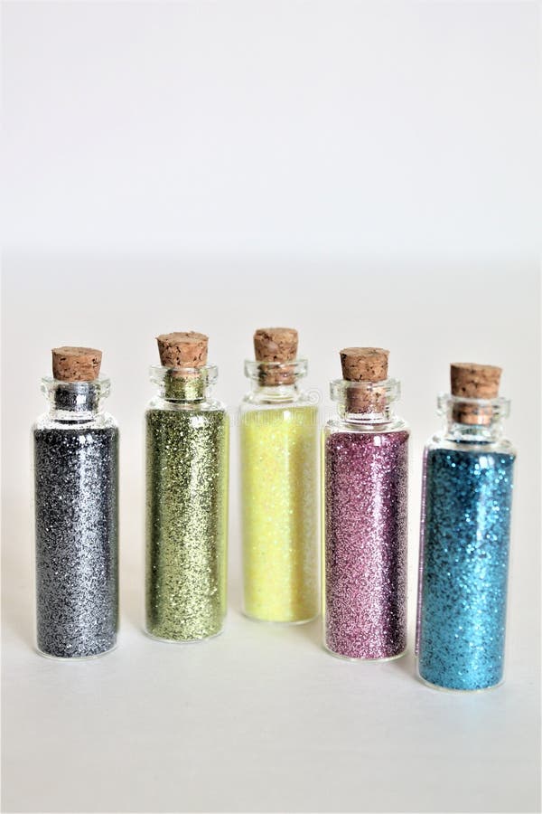 Glitter Bottles Standing Isolated On White Background Stock Photo
