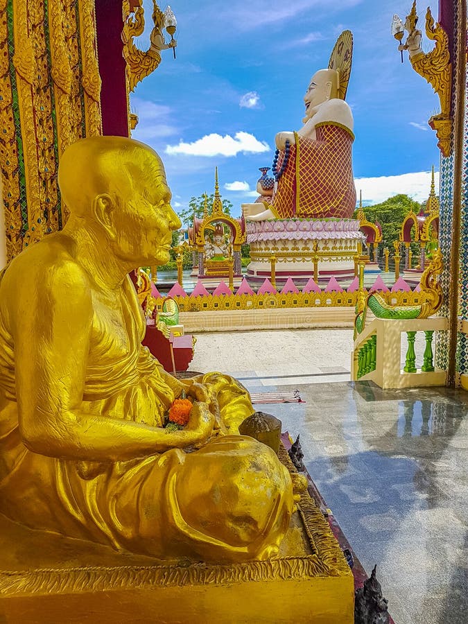 Colorful gold fat laughing Buddha Wat Plai Laem temple Thailand