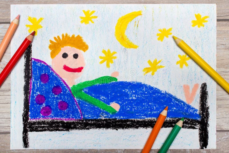 Hand Drawing and Crayons: Smiling Little Boy Lying in a Bed. Stock