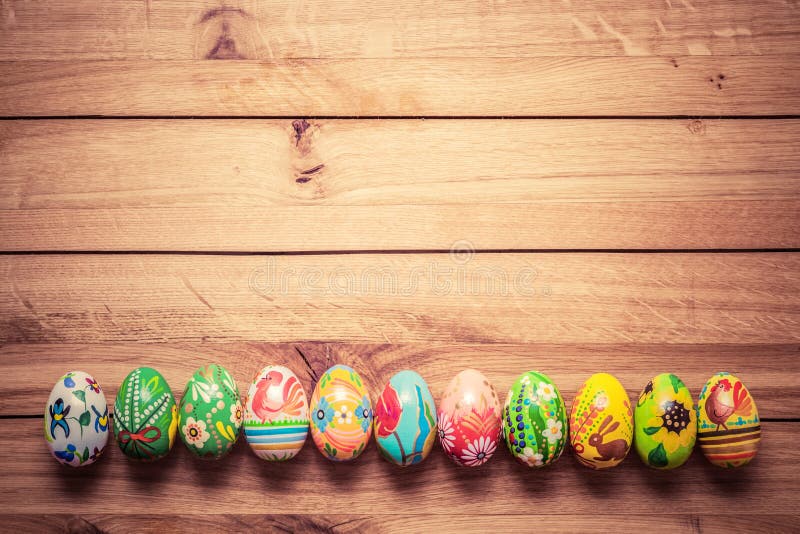 Colorful hand painted Easter eggs on wood. Unique handmade, vintage design. royalty free stock photography Colorful hand painted Easter eggs on wood. Unique handmade, vintage design. royalty free stock photography