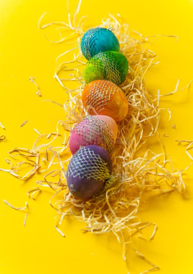 Happy Easter Colorful, Handpainted, Pastel Easter Eggs on a Yellow