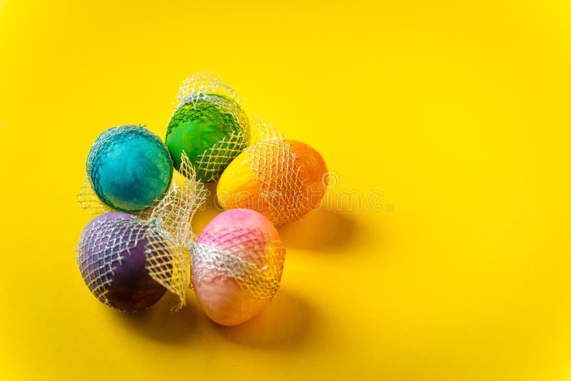 Happy Easter Colorful, Handpainted, Pastel Easter Eggs on a Yellow