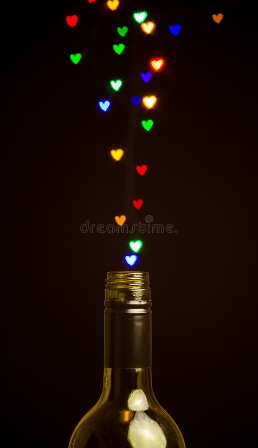 Colorful heart shape lights floating out of the bottle