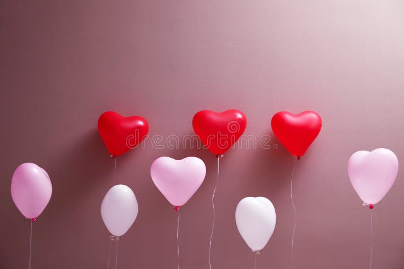 Colorful heart shaped balloons on background. Valentine`s day celebration