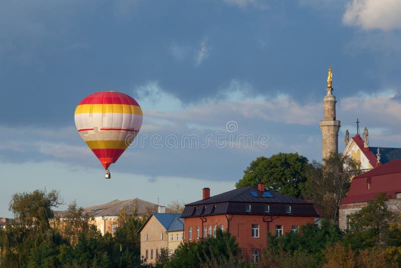 Colorful hot air balloon flying at suset in Old city