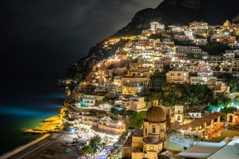 Colorful houses of Positano along Amalfi coast at night, Italy. Night landscape. Travel