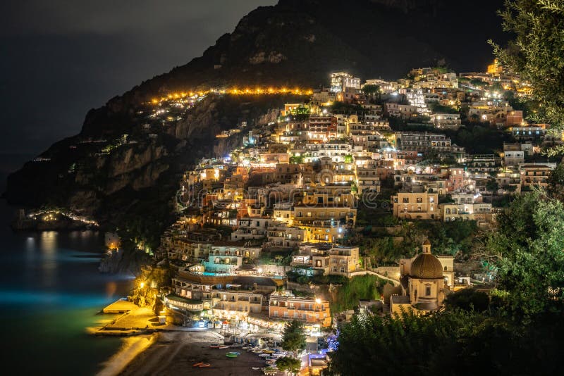 Colorful houses of Positano along Amalfi coast at night, Italy. Night landscape. Travel