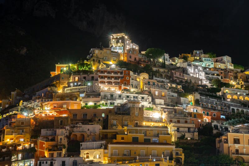 Colorful houses of Positano along Amalfi coast at night, Italy. Night landscape. Travel