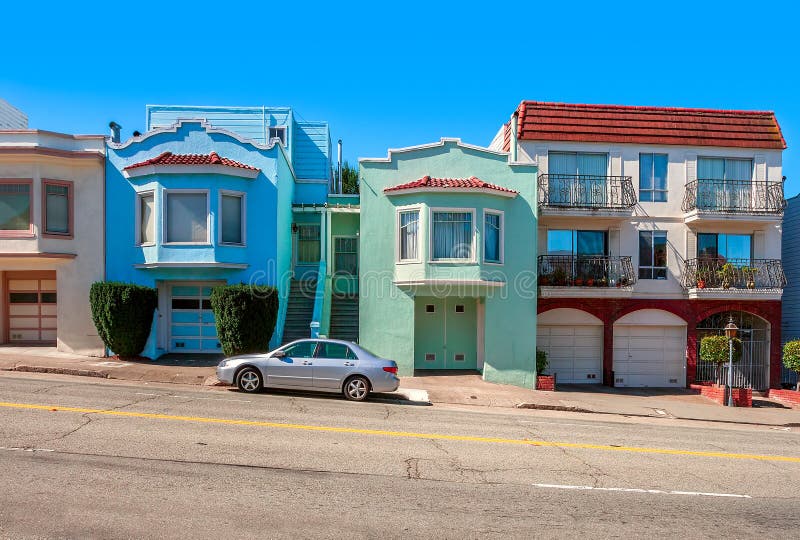 Colorful houses on sloping street in San Francisco.