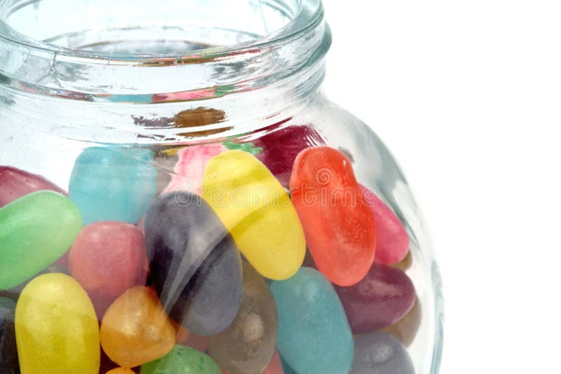 Colorful jelly beans in jar. Macro shot stock photography