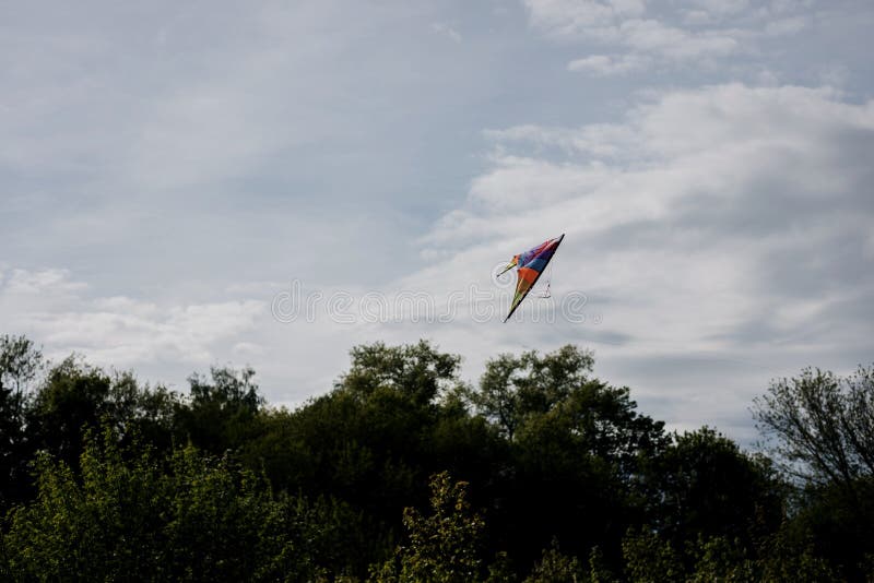 Colorful Kite Flying in the Wind Stock Image Image of kite, cloud