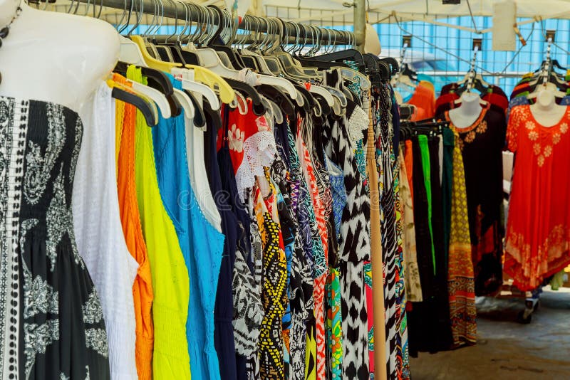 Colorful Ladies Clothes on Clothes Hangers at a Market. Stock Photo ...