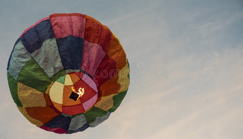 A colorful lantern/balloon is flying in the sky.