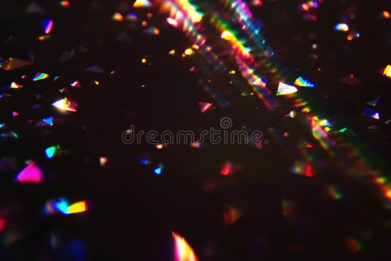 Colorful Light Refractions on Dark Background Creating Vibrant Abstract Effect stock photos