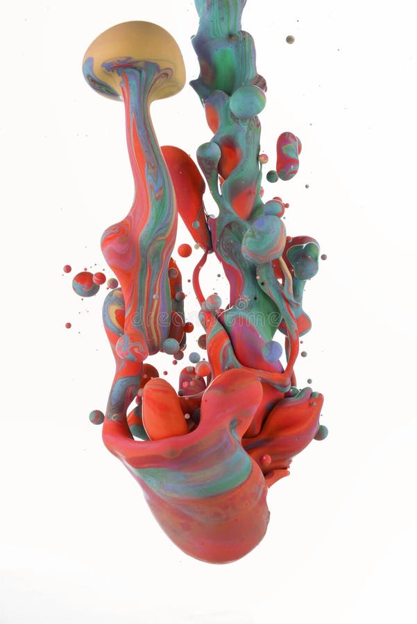 Colorful liquids mixing under water on white background