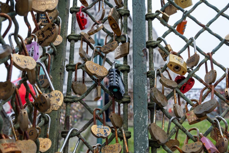 Colorful locks symbolize love and commitment at a city landmark stock image