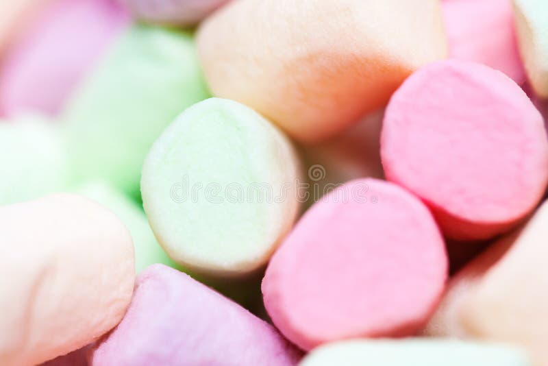 Colorful mini marshmallows background macro. Fluffy marshmallows stock photography