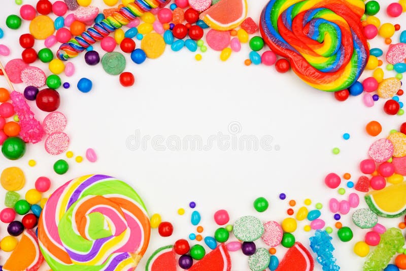 Colorful candies, top view frame over a white background