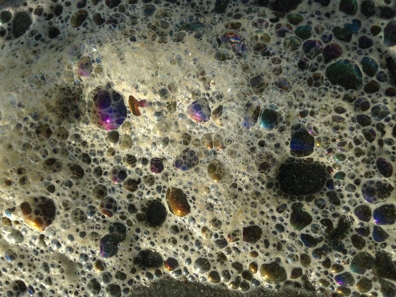 Colorful Ocean Wave Foam Bubbles on Beach Sand. Stock Image Image of
