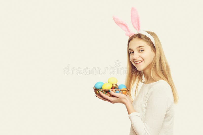 Happy easter girl in bunny ears with colorful painted eggs stock images Happy easter girl in bunny ears with colorful painted eggs stock images